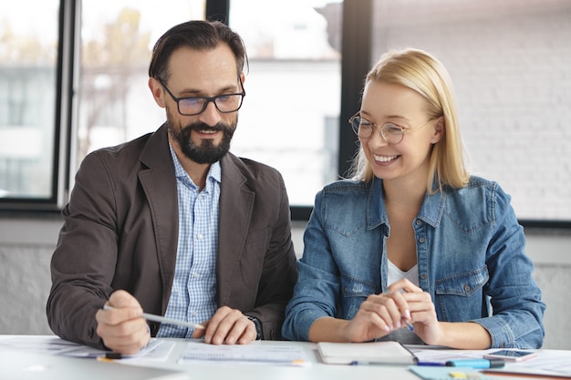 Woman reviewing a checklist with a colleague