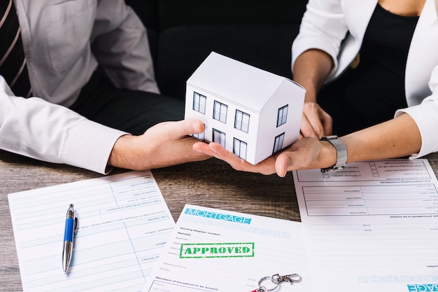 Realtor making a deal with a customer in an office